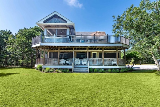 rear view of house featuring a yard