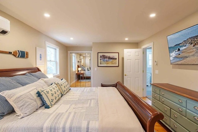 bedroom featuring a wall unit AC