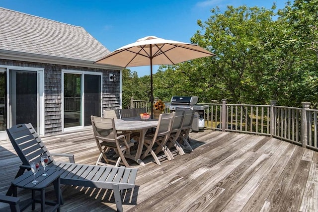 wooden terrace featuring grilling area