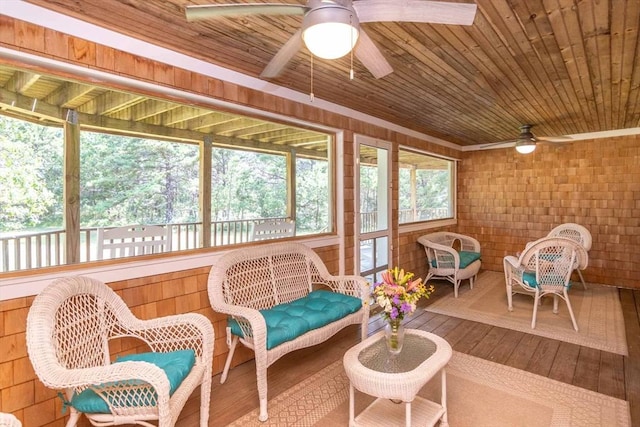 sunroom / solarium with wooden ceiling and ceiling fan