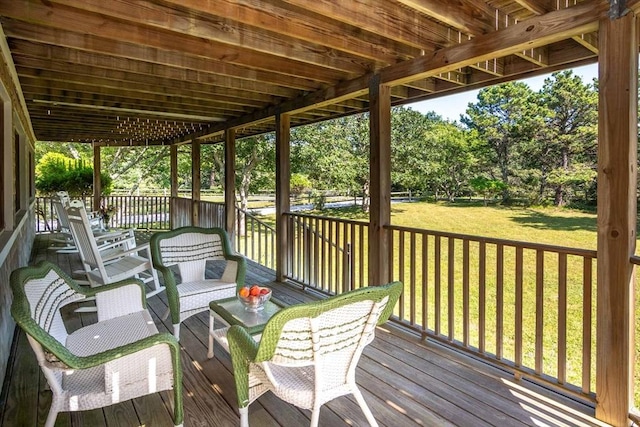 wooden terrace with a lawn