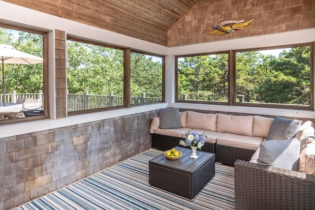 sunroom / solarium featuring vaulted ceiling and wooden ceiling