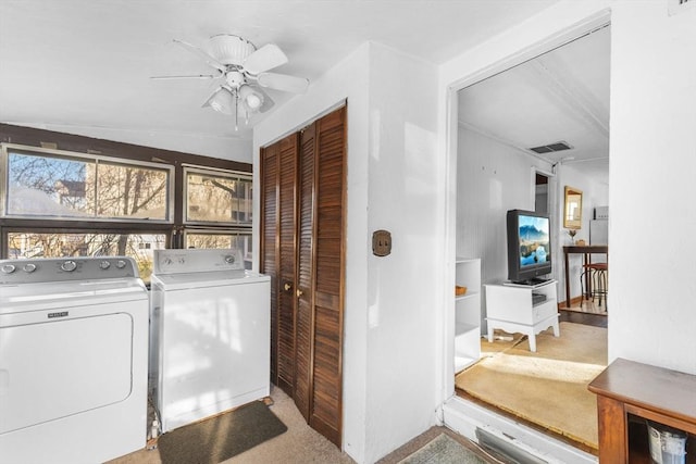 laundry area with washer and dryer, ceiling fan, and light carpet