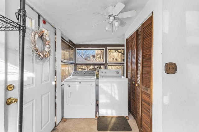 laundry room with light carpet, separate washer and dryer, and ceiling fan