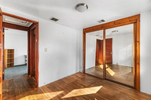 interior space with a closet and dark hardwood / wood-style floors