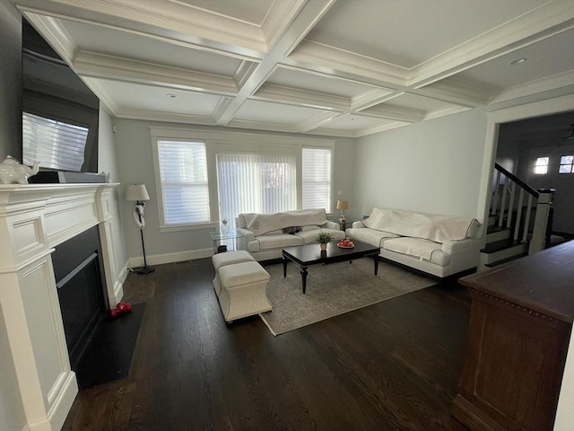 living room with dark hardwood / wood-style floors, beam ceiling, crown molding, and coffered ceiling