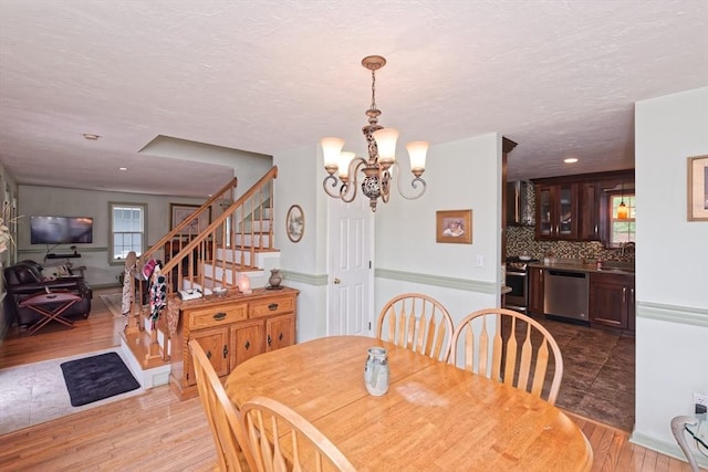 11 Azalea Ln Unit 11, Marlborough, MA 01752 - dining space with wood finished floors, a chandelier, stairway, a textured ceiling, and recessed lighting