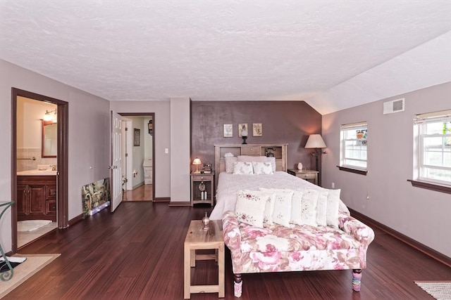 11 Azalea Ln Unit 11, Marlborough, MA 01752 - bedroom featuring dark wood-style floors, a textured ceiling, and ensuite bathroom