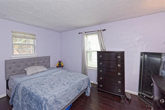 11 Azalea Ln Unit 11, Marlborough, MA 01752 - bedroom featuring wood finished floors, multiple windows, and a textured ceiling