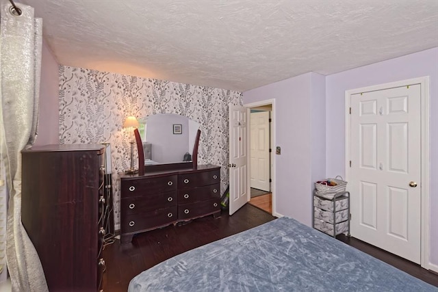 11 Azalea Ln Unit 11, Marlborough, MA 01752 - bedroom with wallpapered walls, wood finished floors, and a textured ceiling