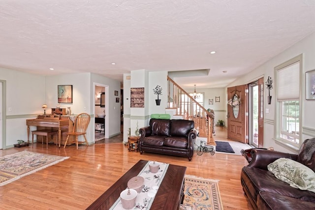 11 Azalea Ln Unit 11, Marlborough, MA 01752 - living area with wood finished floors, stairway, a chandelier, recessed lighting, and a textured ceiling