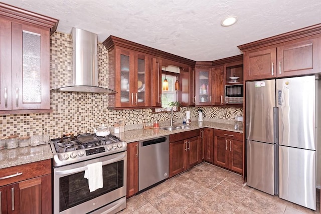 11 Azalea Ln Unit 11, Marlborough, MA 01752 - kitchen featuring appliances with stainless steel finishes, wall chimney exhaust hood, backsplash, light stone counters, and a textured ceiling