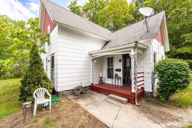 6 Oak St, Monson, MA 01057 - view of front of property with roof with shingles, a chimney, and covered porch