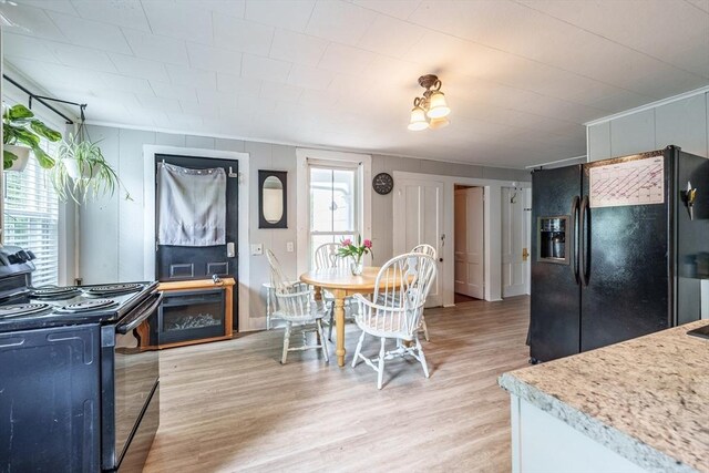 6 Oak St, Monson, MA 01057 - kitchen featuring black appliances, light wood-style flooring, and light countertops