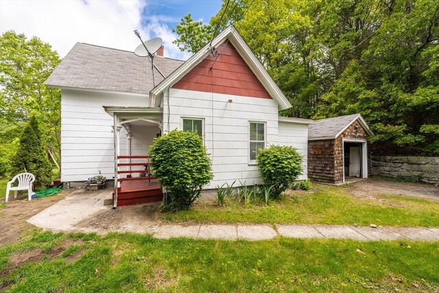 6 Oak St, Monson, MA 01057 - rear view of property with a shingled roof, a patio, and an outdoor structure