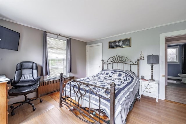 6 Oak St, Monson, MA 01057 - bedroom with radiator, light wood finished floors, ornamental molding, and baseboards
