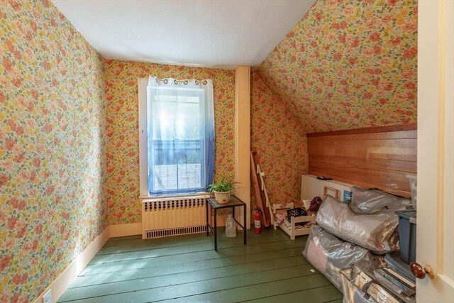 6 Oak St, Monson, MA 01057 - bedroom featuring radiator heating unit, wallpapered walls, and hardwood / wood-style flooring
