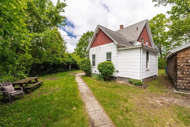 6 Oak St, Monson, MA 01057 - view of property exterior with a chimney, a yard, and roof with shingles