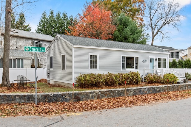 view of side of property with a wooden deck