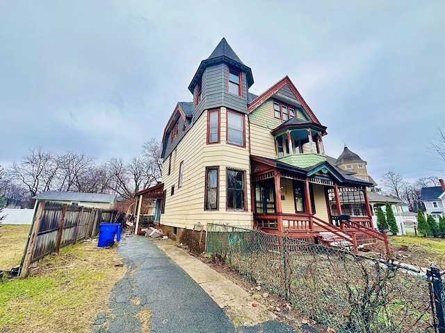 205 Saint James Ave, Springfield, MA 01109 - victorian-style house with a porch and asphalt driveway