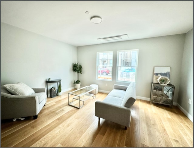 living area with light hardwood / wood-style flooring