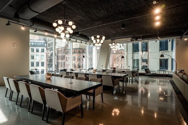 dining space with an inviting chandelier