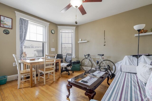 office area with hardwood / wood-style floors, baseboards, and ceiling fan