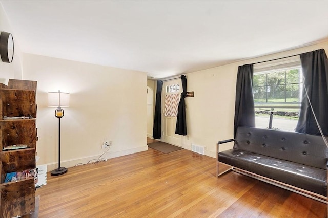 unfurnished room featuring light wood-style floors and baseboards