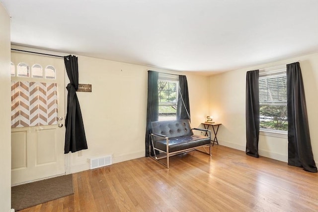 sitting room featuring wood finished floors and baseboards