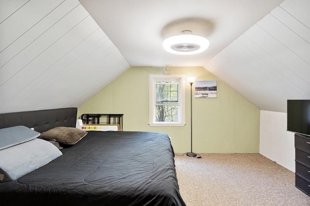 carpeted bedroom with vaulted ceiling