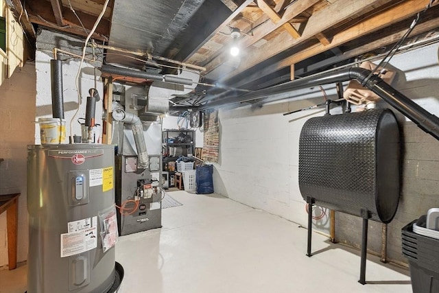 unfinished below grade area featuring electric water heater and concrete block wall