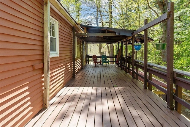 wooden deck featuring outdoor dining space