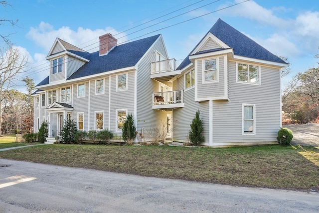 view of front of home featuring a balcony