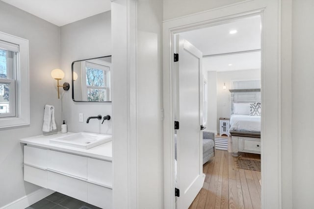 bathroom with wood-type flooring and vanity