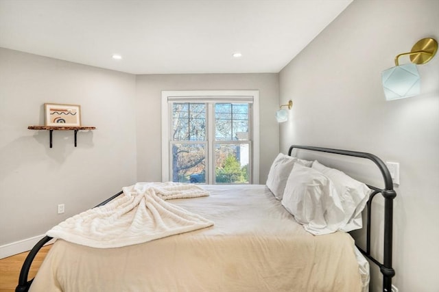 bedroom with hardwood / wood-style flooring