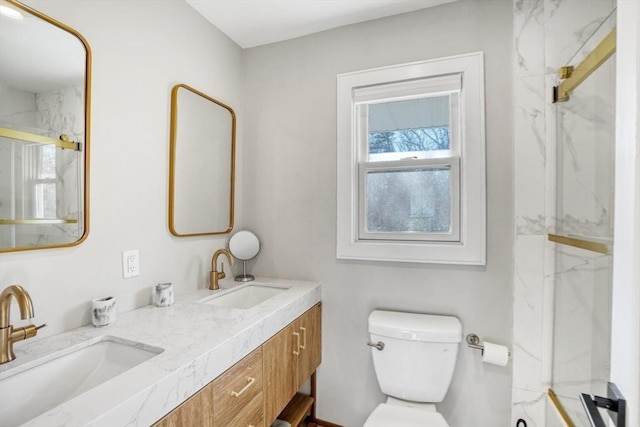 bathroom featuring vanity, toilet, and walk in shower