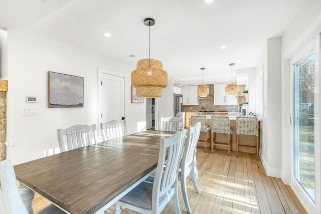 dining space featuring light hardwood / wood-style flooring