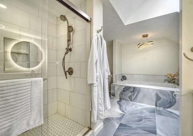 bathroom with a garden tub and a stall shower