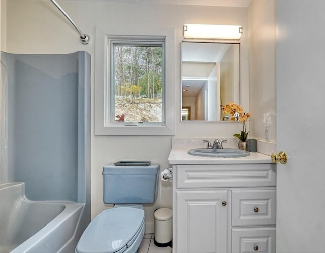 bathroom featuring vanity, shower / bathtub combination, and toilet