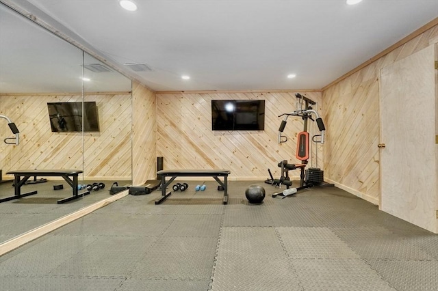 workout area with wood walls, baseboards, and recessed lighting