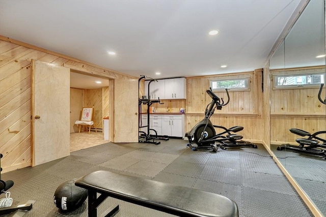 workout area featuring wooden walls