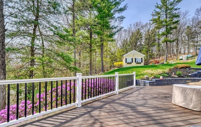 wooden terrace featuring a yard