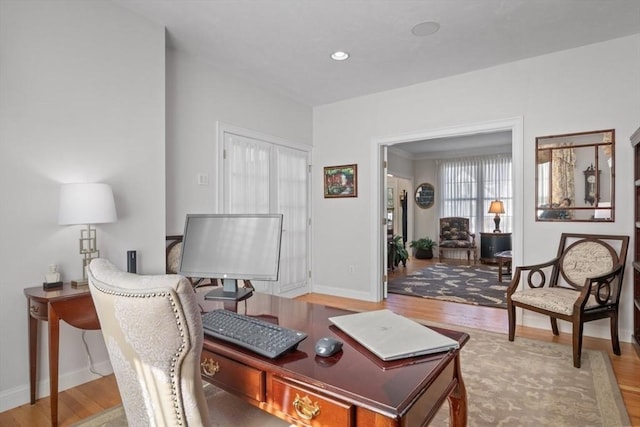 living area with light hardwood / wood-style flooring