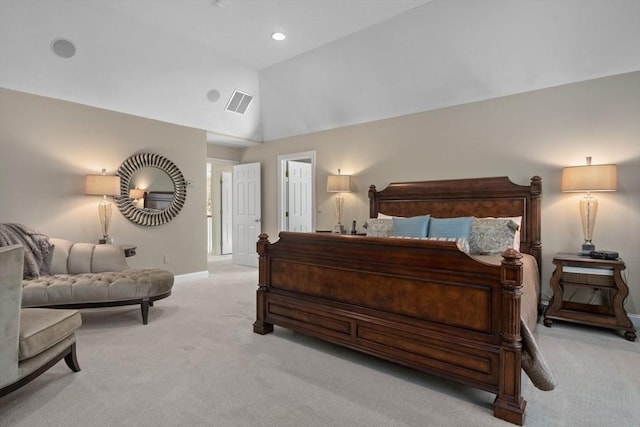 bedroom featuring vaulted ceiling and light colored carpet