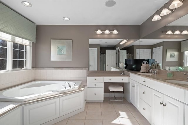 bathroom with vanity, tile patterned floors, and shower with separate bathtub