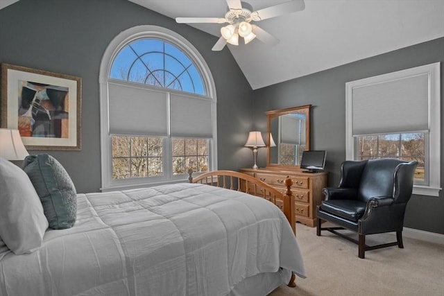 bedroom with lofted ceiling, light colored carpet, and ceiling fan