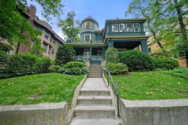 179 Rawson Unit 2, Brookline, MA 02445 - victorian-style house featuring stairway, covered porch, and a front yard