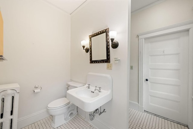 179 Rawson Unit 2, Brookline, MA 02445 - half bath featuring tile patterned flooring, ornamental molding, toilet, and baseboards