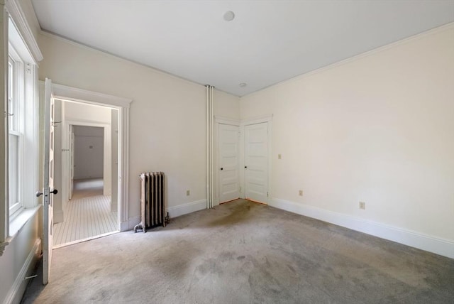 179 Rawson Unit 2, Brookline, MA 02445 - carpeted spare room with radiator heating unit, baseboards, and ornamental molding
