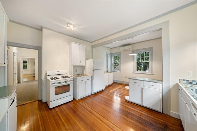 179 Rawson Unit 2, Brookline, MA 02445 - kitchen featuring white appliances, white cabinetry, an AC wall unit, ornamental molding, and dark wood-style floors